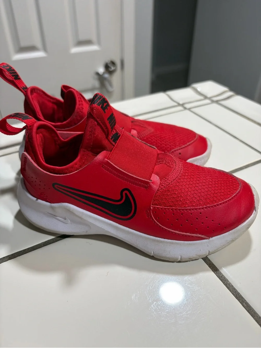 Nike Kids Slip-On Athletic Sneakers in Red and Black